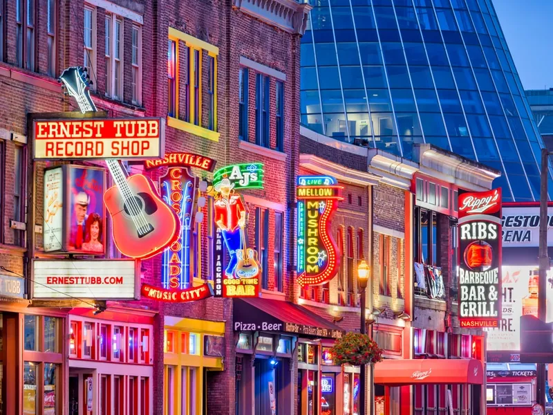Neon signs for record shops, bars, and barbecue on Lower Broadway
